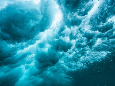 Abstract blue light waves representing energy and movement.